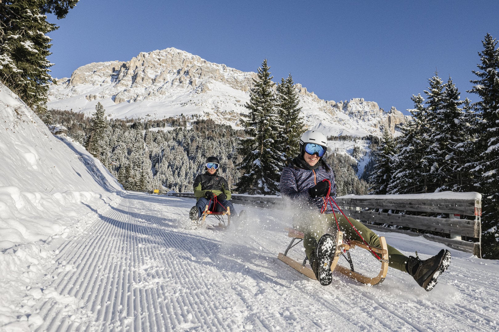 Tobogganing on ski holiday in Italy